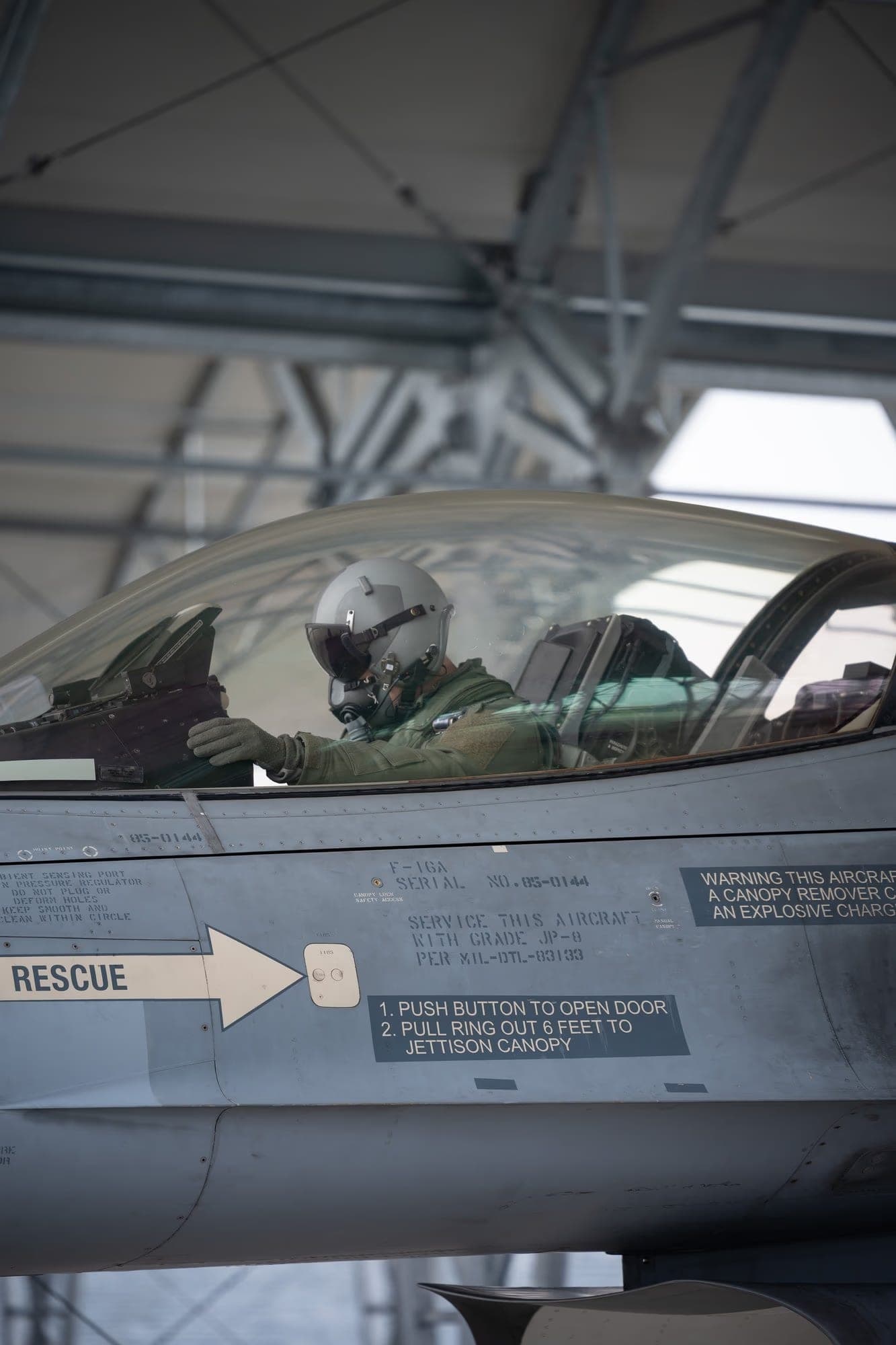 ROAF F-16 pilot in cockpit with helmet — close side view, Fetești