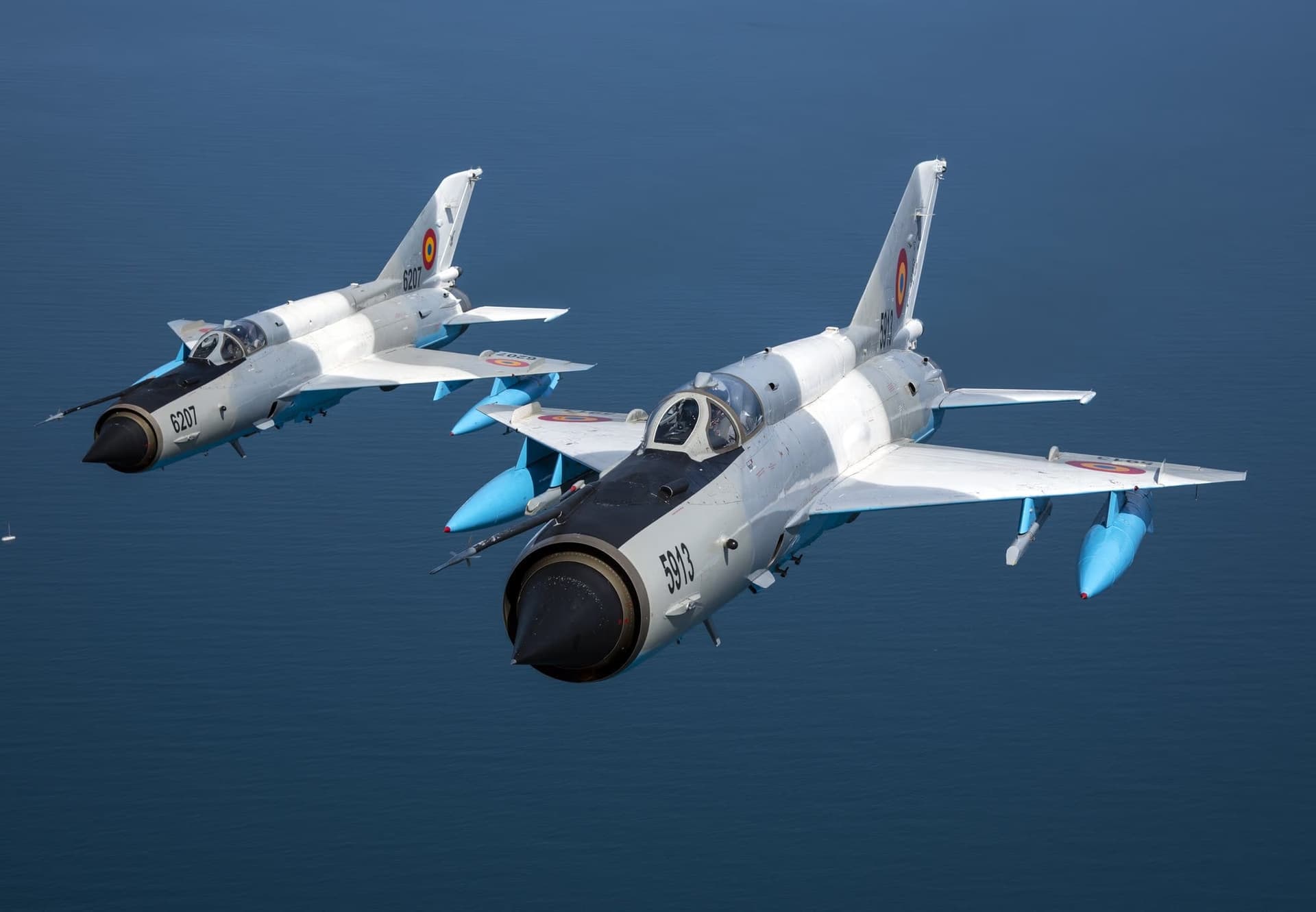 Two MiG-21 LanceRs (5913 + 6207) in formation over the Black Sea — second frame