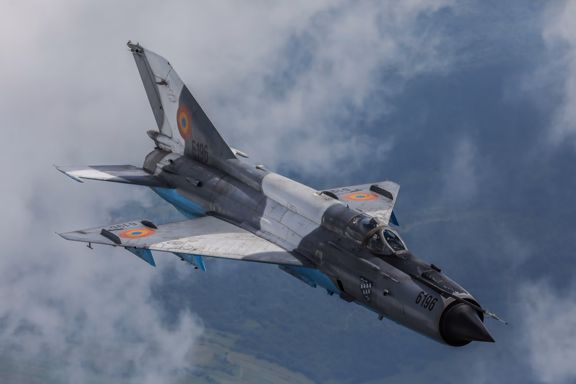MiG-21 LanceR — aircraft 6196 in flight through clouds