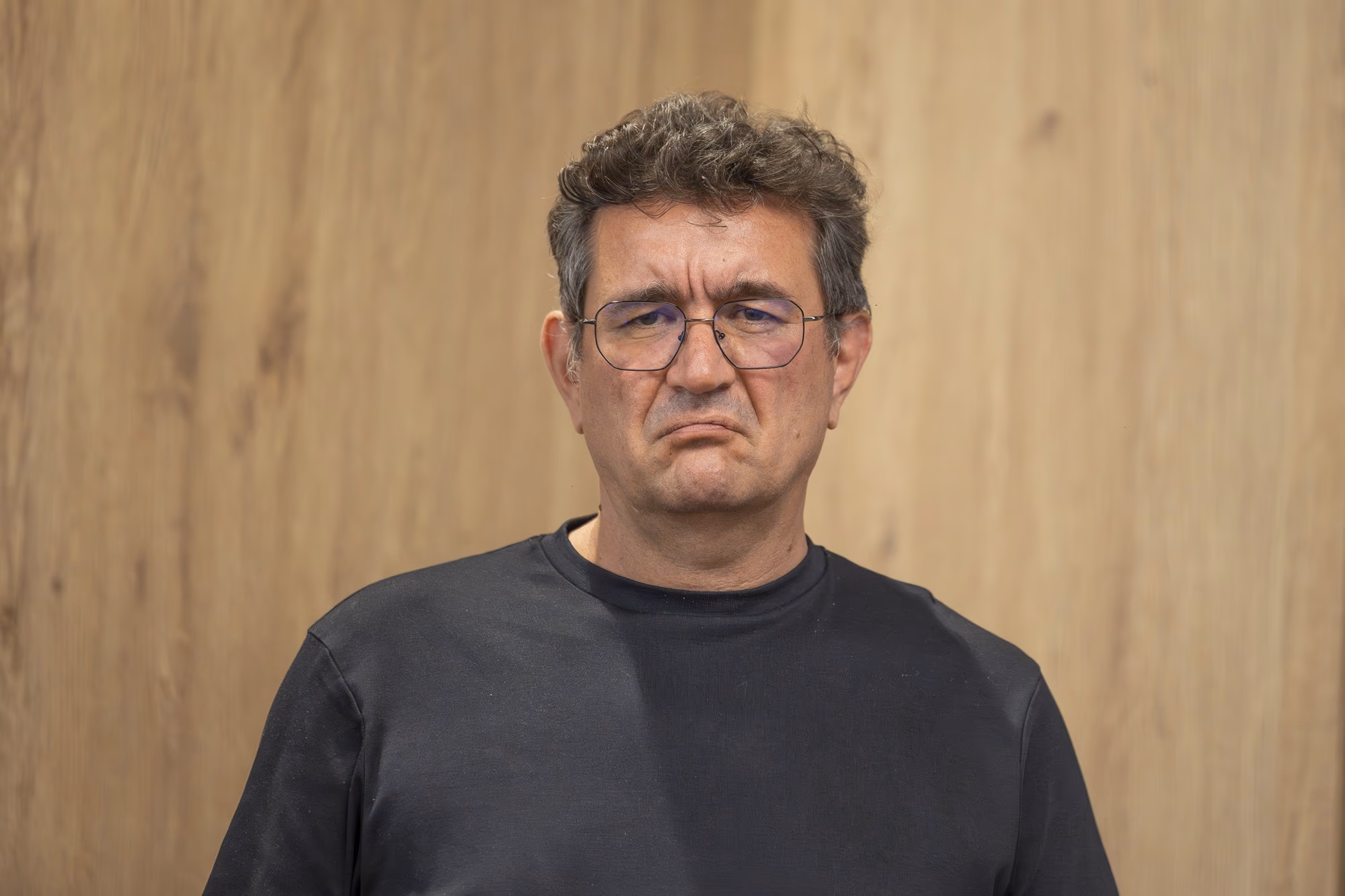Chinezu solo portrait — the expression of a man who has realized he has been audited.
