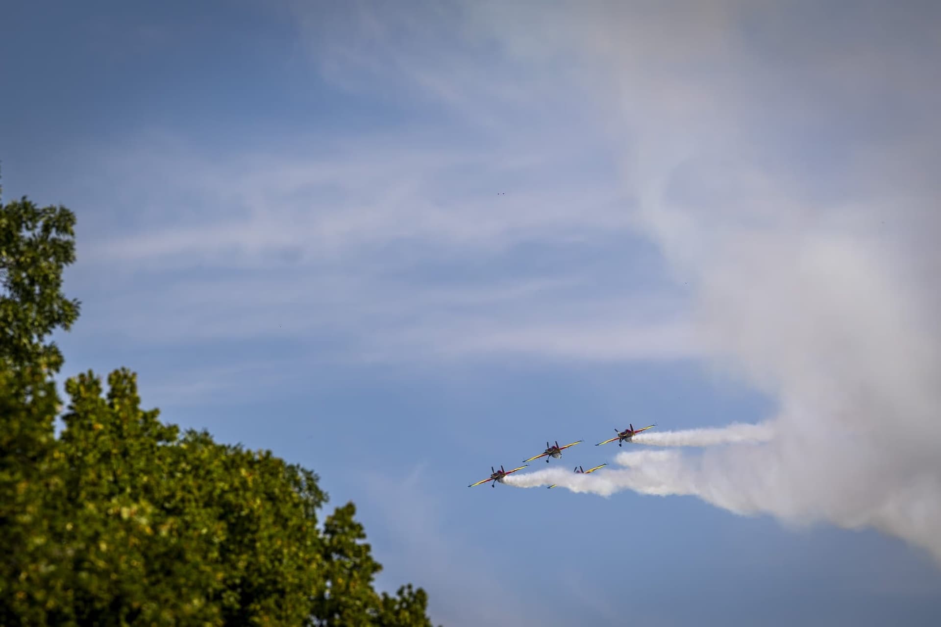 The aerobatic formation above the trees. Photo: AdiCoco.com