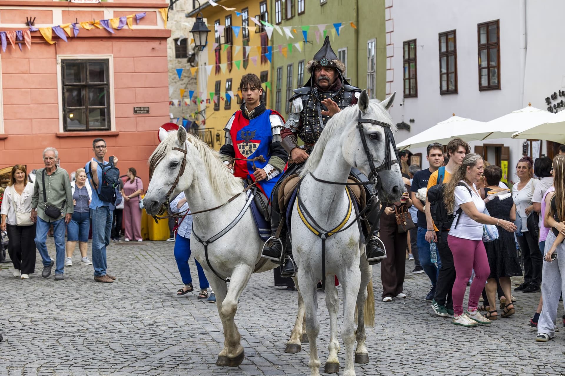 The knights on white horses among the people