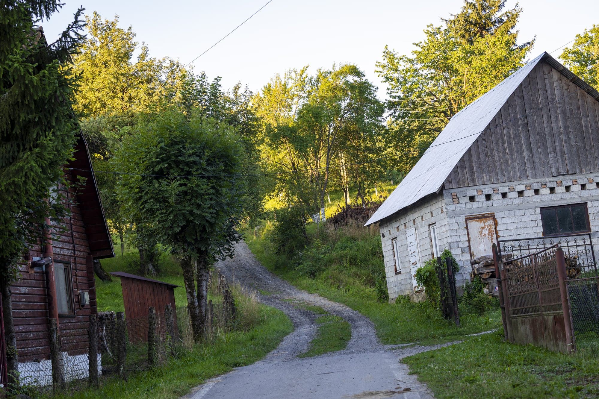The fork in the village road, with wooden barns