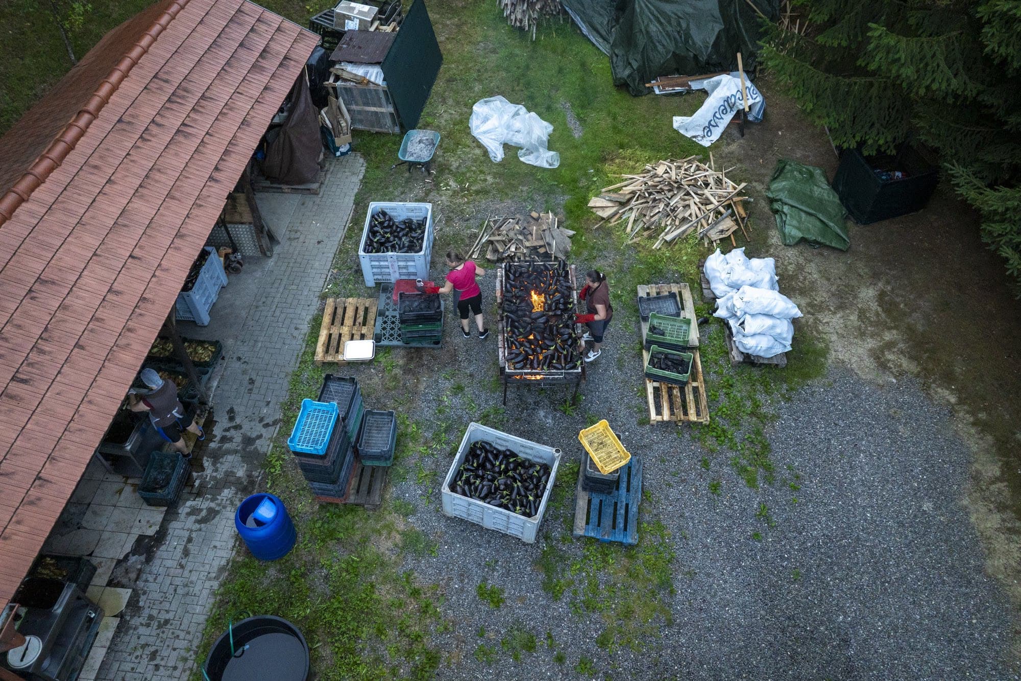 The aubergine factory seen from above, with the fire burning