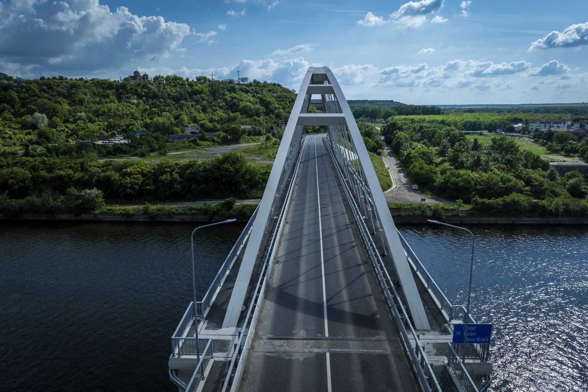 The bridge head-on, its arches leaning towards each other to form a portal