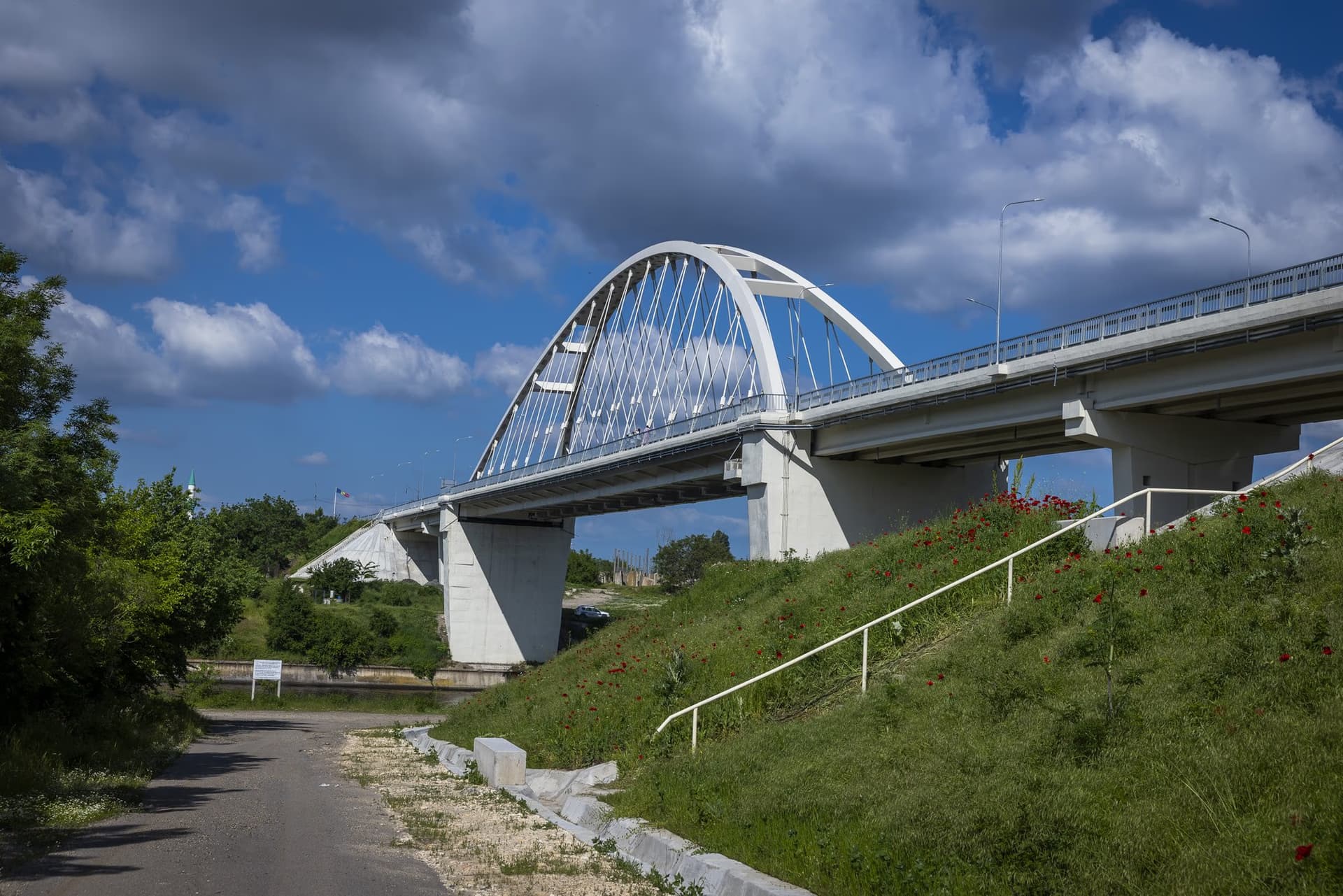 The approach viaduct and the arch, seen from below on the grassed embankment