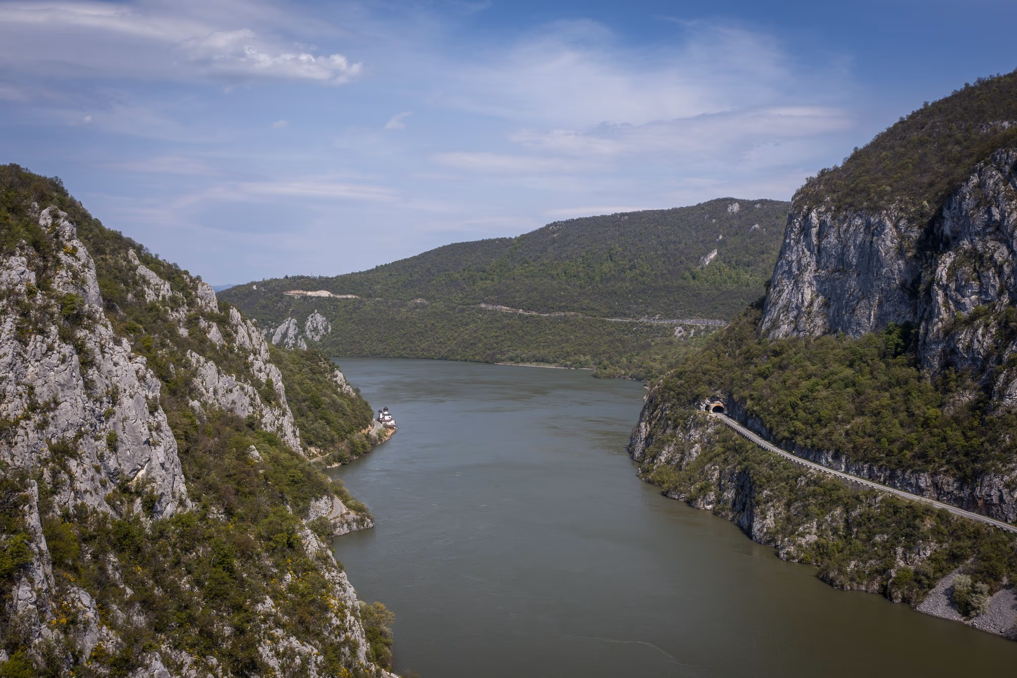 The Danube Cauldrons, with a barge passing between the limestone walls