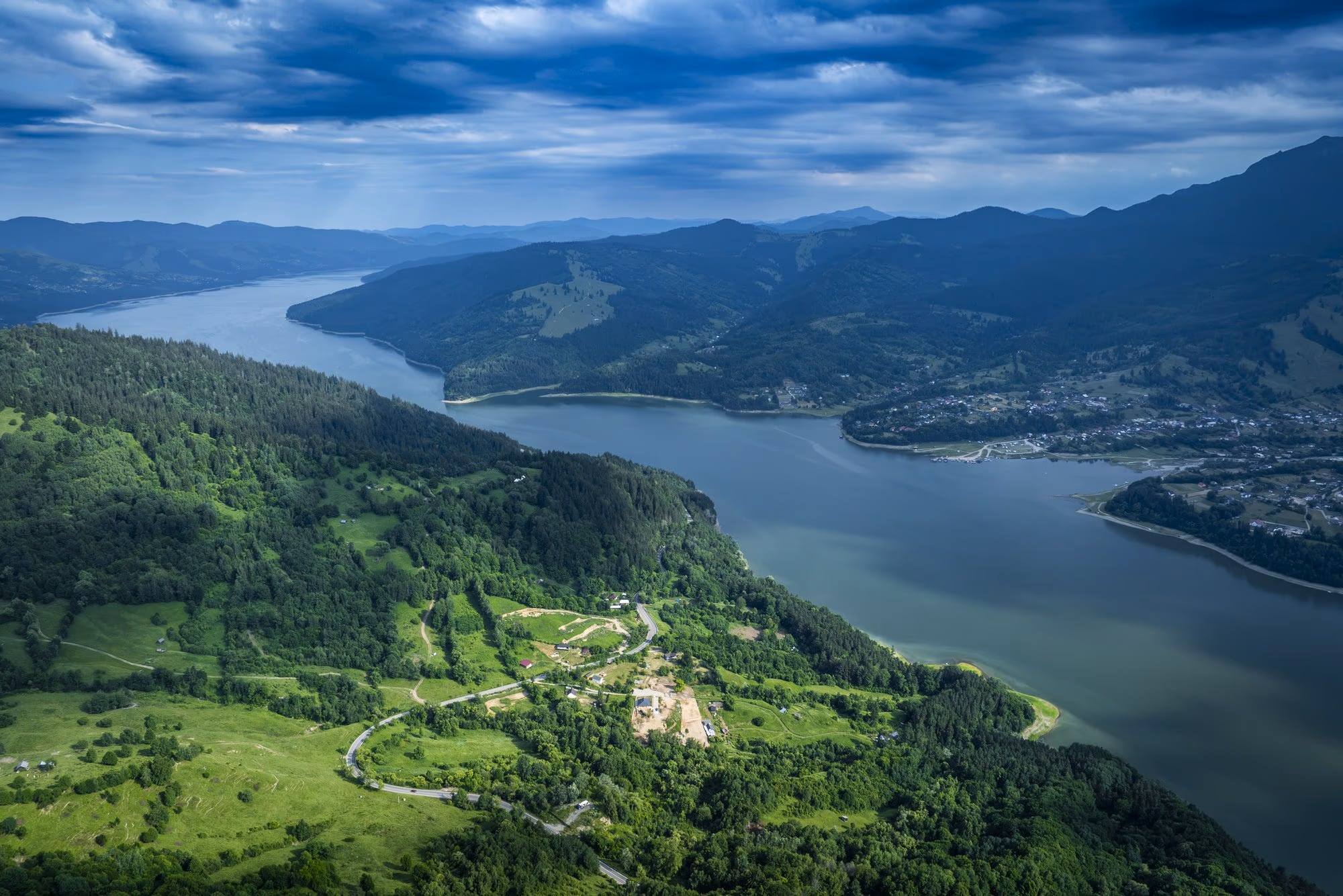 Lake Izvorul Muntelui seen from a drone, with the Bistrița mountains behind