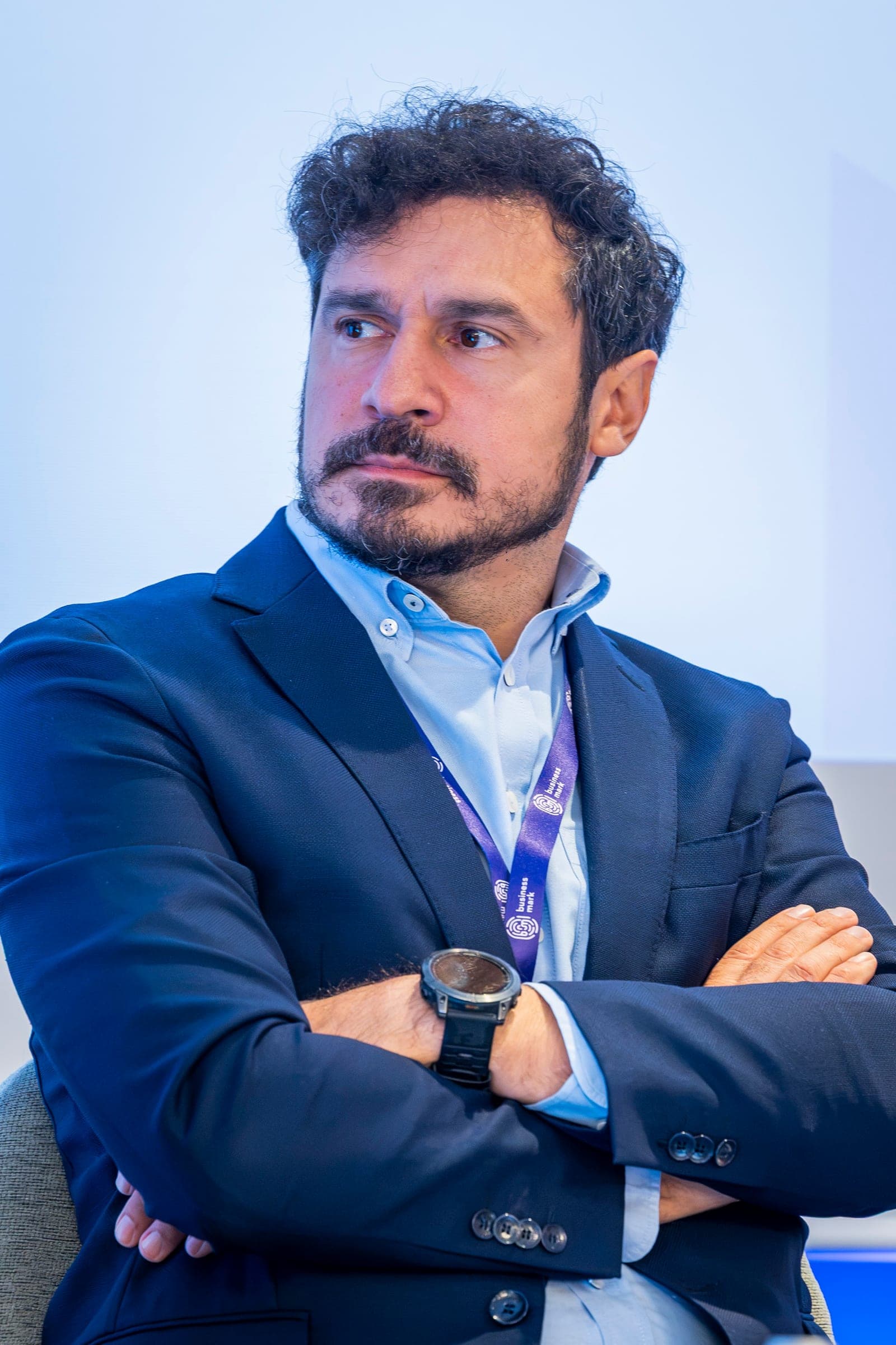 Lucian Opriș, arms folded, listening from the stage