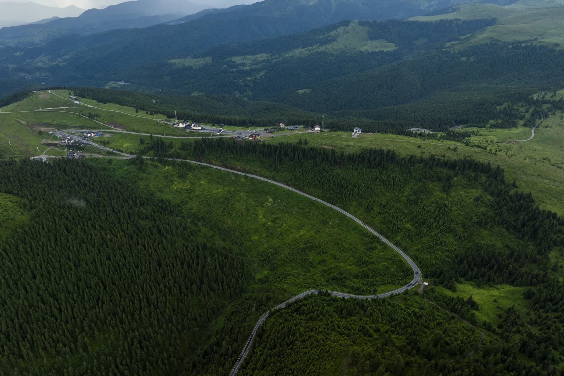 The DN18 crossing the Prislop saddle, with the monastery, seen from about 1,700 metres